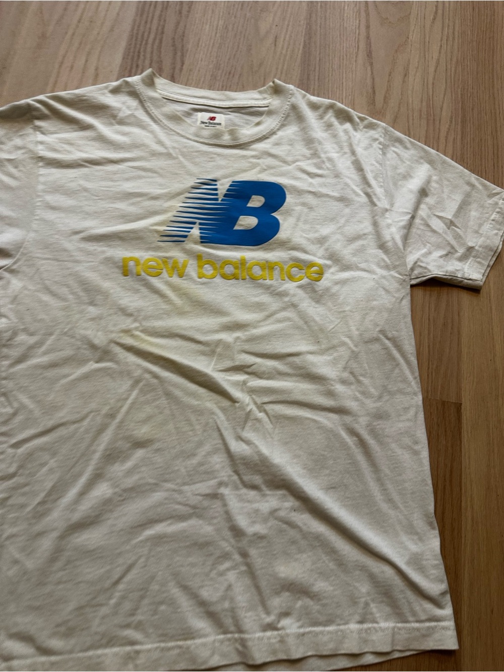 New Balance Cream Short-Sleeve Tee with Blue NB and Yellow Text